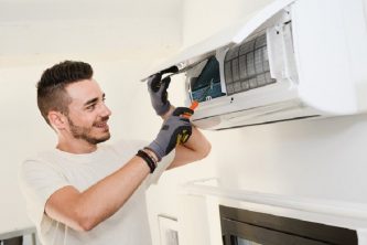 worker in white shirt repair aircon